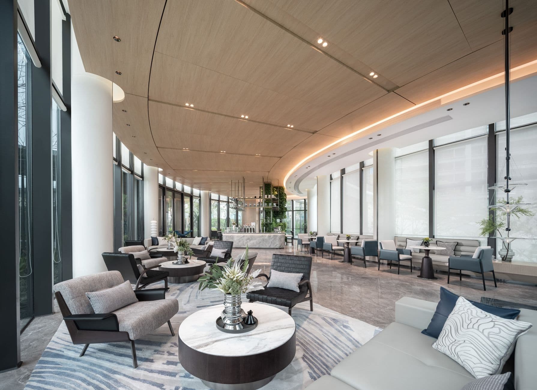 Spacious luxury hotel lobby with modern design and elegant furnishings.